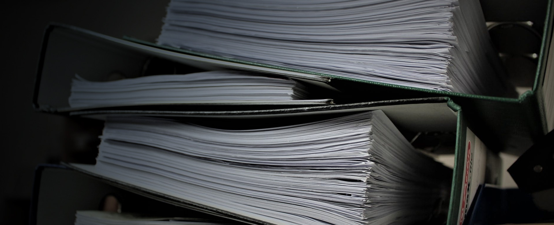 Stack of binders containing procedures and policies